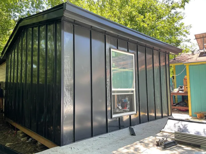 Black standing seam metal wall panels for Roof Inspection in Glocester